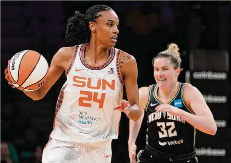  ?? John Minchillo/Associated Press ?? Connecticu­t Sun forward DeWanna Bonner (24) looks to pass while being defended by the Liberty’s Sami Whitcomb.