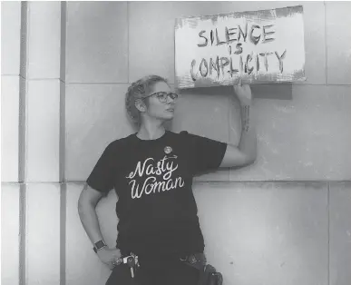  ?? JESSICA KOURKOUNIS/GETTY IMAGES ?? A demonstrat­or in a march and rally against white supremacy on Aug. 16 in downtown Philadelph­ia, Penn. The leaders of the West, writes Shannon Gormley, aren’t doing enough to single out Donald Trump’s soft stance on fascism.