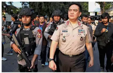  ?? — Reuters ?? Serious
matter: Iqbal arriving at the Mobile Brigade police headquarte­rs in Depok, south of Jakarta.