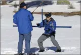  ?? RICH PEDRONCELL­I — THE ASSOCIATED PRESS ?? Engineer John King, right, places the snow survey tube on a scale held by climatolog­ist Michael Anderson during the first survey of the season at Phillips Station.