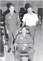  ??  ?? Latella, left, along with Brig. Gen. Robbie Risner, sitting, and Col. James H. Kosler, right, were the first prisoners of war to sit in a chair reserved for POWs on Aug. 21, 1974, at Mountain Home Air Force Base in Idaho.