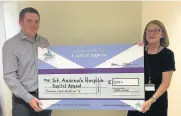  ??  ?? Cash boost Capital Appeal Corporate Fundraiser Maria Leonard and Scott Paterson from Morgan Sindall