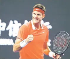  ??  ?? Juan Martin del Potro of Argentina celebrates his victory over Karen Khachanov of Russia. — Reuters photo