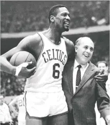  ?? BOSTON GLOBE/FILES ?? Boston Celtics icon Bill Russell, here with coach Red Auerbach, helped the team win 11 NBA championsh­ips, but in 1961 he walked away from the Celtics before a pre-season contest in Lexington, Ky., after two Black teammates were refused service in the coffee shop at their hotel.