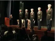  ?? RICHARD PAYERCHIN — THE MORNING JOURNAL ?? Lorain High School JROTC cadets pay tribute to service members as part of the school’s Veterans Day ceremony Nov. 7 at the school’s Performing Arts Center.