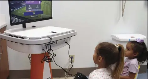  ?? PHOTO TOM BODUS ?? Kids take on one of the PMH pediatric unit’s two new gaming systems installed as part of an extensive renovation projected funded by the PMH Foundation.