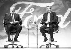  ??  ?? This handout photo courtesy of Ford Motor Company shows Bill Ford (right) and Jim Hackett as Hackett met with employees and members of the press to discuss his appointmen­t as president and CEO of Ford Motor Company in Dearborn, Michigan. Ford Motor...