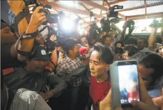  ?? Mark Baker / Associated Press 2015 ?? Aung San Suu Kyi’s government has pursued legal charges against dozens of journalist­s, along with other attempts to suppress and discredit the media.