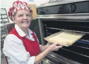  ?? ?? FEEDING TIME: Great-grandmothe­r Rosemary Stokes, 73, started working in Birmingham school kitchens in 1974.