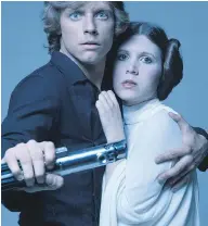  ?? TERRY O’NEILL / GETTY IMAGES ?? Mark Hamill and Carrie Fisher carved immortalit­y as Luke Skywalker and Princess Leia in the Star Wars saga.