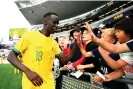  ?? Photograph: Hannah Peters/Getty Images ?? Thomas Deng thanks fans after last month’s friendly against New Zealand.
