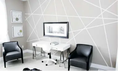  ?? JEAN LEVAC/ POSTMEDIA NEWS ?? Geometric patterns are the latest fad in wall art, says interior designer Donna Correy. Here it highlights the width of the room.