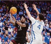  ?? Andy Lyons/Getty Images ?? Wade Taylor IV, left, scored a game-high 32 points in the Aggies’ win over Kentucky on Friday.