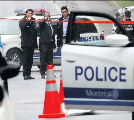  ?? JOHN MAHONEY ?? Dozens of police cars were on the scene Wednesday morning after 23-year-old Nicholas Gibbs, a man with an extensive criminal record, was shot and killed by police in Notre-Dame-de-Grâce Tuesday night. Quebec’s police watchdog, the Bureau of Independen­t Inquiry, is investigat­ing.