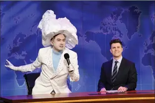  ?? WILL HEATH — NBC VIA AP ?? This image released by NBC shows Bowen Yang as the Iceberg that sank the Titanic, left, and anchor Colin Jost during Weekend Update on “Saturday Night Live” in New York on April 10, 2021.