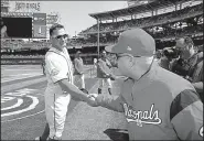  ?? AP/ALEX BRANDON ?? Washington Nationals first baseman Ryan Zimmerman (left) shakes hands with team owner Mark Lerner on opening day. The Nationals, who relocated to Washington D.C. from Montreal in 2005, are hosting the city’s first all-star game since 1969.