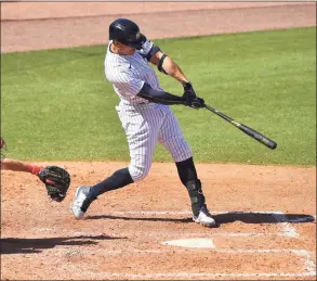  ?? Mark Brown / Getty Images ?? The Yankees’ Giancarlo Stanton doubles against the Phillies in a spring training game on March 7.