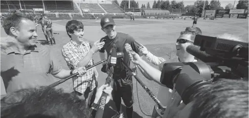  ?? STEVE BOSCH/ PNG ?? Trevor Gretzky, the son of hockey icon Wayne, speaks to reporters on Wednesday at Nat Bailey Stadium before his Boise Hawks played the Vancouver Canadians. Later in the evening, Gretzky went 1- for- 3 at the plate, but the C’s won 6- 5. Vancouver...