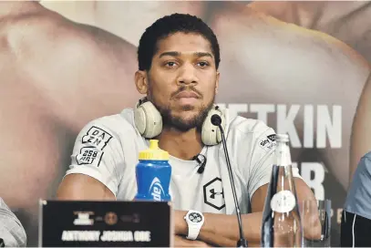  ?? Picture: AFP ?? GAME FACE. Britain’s Anthony Joshua is taking things very seriously as he bids to regain his heavyweigh­t titles in Diriyah tomorrow night.