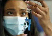  ?? STEVEN SENNE — THE ASSOCIATED PRESS FILE ?? A nurse prepares a vaccine vaccine at a vaccinatio­n clinic last May in Foxborough, Mass. The delta form of the coronaviru­s continues to ravage the U.S.