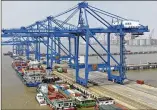  ?? CHINATOPIX VIA AP ?? Container ships sit at a port Monday on the Yangtze River in Nantong, China. China’s import and export growth accelerate­d in August amid spread of the delta variant.