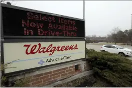  ?? NAM Y. HUH — THE ASSOCIATED PRESS FILE ?? A Walgreens sign outside the store in Wheeling, Ill.