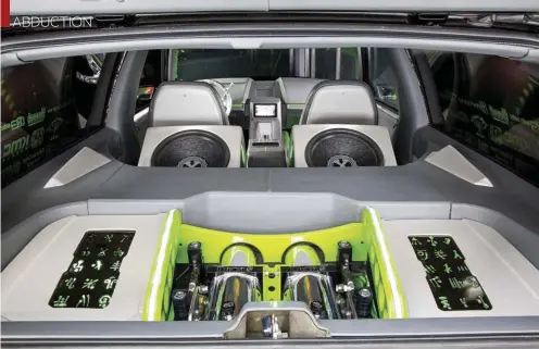  ??  ?? THE TAHOE IS PACKING SOME SERIOUS HEAT INSIDE THE CABIN WITH TWO 15-INCH POWERBASS SUBWOOFERS AND A CUSTOM AMP RACK ARTFULLY DESIGNED AND EXECUTED BY STEVE YIU OF ELEVATED DESIGNS.