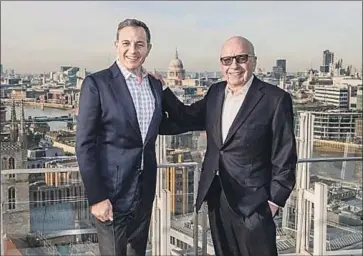  ?? Walt Disney Co. ?? RUPERT MURDOCH, right, shown with Disney Chief Executive Bob Iger in 2017, is dismantlin­g his life’s work. Walt Disney Co. on Tuesday will absorb Fox’s legendary movie and television production studios.
