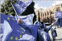  ?? PICTURE: AP ?? A supporter of Britain staying in the EU wears an EU flag mask during an antiBrexit protest outside the Houses of Parliament in London.