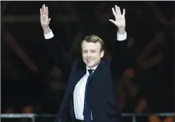  ?? AP PHOTO/THIBAULT CAMUS ?? French President-elect Emmanuel Macron gestures during a victory celebratio­n outside the Louvre museum in Paris Sunday. Speaking to thousands of supporters from the Louvre Museum's courtyard.