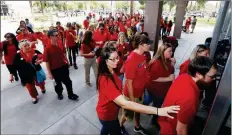  ?? ASSOCIATED PRESS ?? ARIZONA TEACHERS WALK INTO THE SENATE building as they protest for higher pay at the capitol Wednesday in Phoenix. The protest comes as educators try to persuade the Legislatur­e and Republican Gov. Doug Ducey to boost their pay significan­tly.