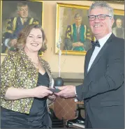  ?? (Pic: John Allen) ?? UCC Alumni award winner Judge Helen Boyle receiving her award from UCC President John O’Halloran at the UCC Alumni Achievemen­t Awards on Friday.