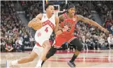  ?? MARK BLINCH/GETTY ?? Scottie Barnes (4) of the Toronto Raptors drives against Ayo Dosunmu of the Chicago Bulls on Tuesday. The Raptors play the Wizards today at 7:30 p.m. on NBC Sports Washington.