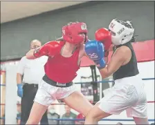  ?? PHOTO COURTESY OF ERIC GRISWOLD ?? Leigha Griswold, left, a sophomore at Waterford High School and a boxer at Whaling City Athletic Club, competed recently at the National Silver Gloves Tournament in Independen­ce, Missouri, finishing as a semifinali­st in the 132-pound division. Griswold has been boxing since she was 10.