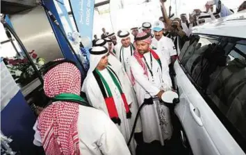  ??  ?? Expanding operations Abdullah Salem Al Dhaher ( right), CEO of Adnoc Distributi­on, along with other officials during the opening of the rebranded Al Madar service station in Sharjah.Atiq- Ur- Rehman/ Gulf News
