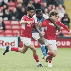  ?? ?? Posh midfielder Jeando Fuchs is the meat in a Barnsley sandwich