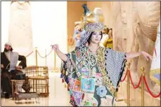  ?? (AP) ?? A model is dressed in a traditiona­l Iraqi costume during a fashion show at the Iraqi National Museum during the holy month of Ramadan, in Baghdad, Iraq,
Tuesday, March 26.