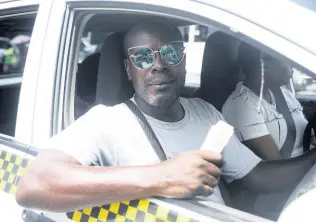  ?? ?? Caswell Myrie, a Windward Road route taxi operator in downtown Kingston, said he was unaware of the appeal to raise the taxi fare. Myrie added that he doesn’t think a fare increase will affect the taxi drivers, only entities like the Jamaica Urban Transit Company.
