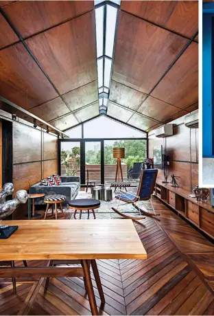  ??  ?? DETAILED DESIGN The timber hut with an eased ridge light ( above); Traditiona­l arumala mirrors from Kerela form a backdrop to the formal dining room ( top right)