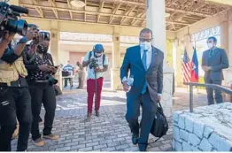  ?? JOSEPH ODELYN/AP ?? Assistant Secretary for Western Hemisphere Affairs Brian Nichols leaves at the end of a news conference Friday at the U.S. Embassy in Port-au-Prince, Haiti.