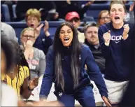  ?? Stephen Dunn / Associated Press ?? UConn’s Evina Westbrook cheers for her team from the bench during a game against California on Nov. 10, 2019.