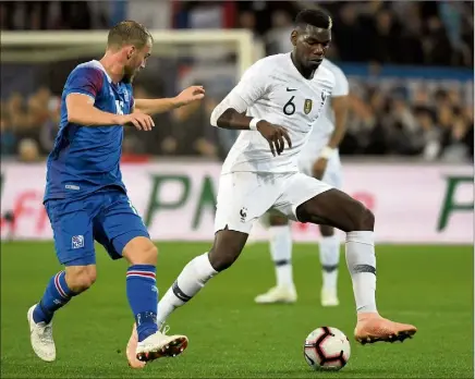  ?? (Photos AFP) ?? Les Bleus de Paul Pogba ont longtemps eu du mal face à de solides islandais, hier à Guingamp