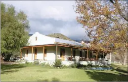  ??  ?? The main house on Harmony Farm, which is toward the west end of the Keisie Valley, near Montagu, has a large covered veranda with a built-in braai.