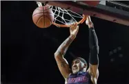  ?? JESSICA HILL - THE ASSOCIATED PRESS ?? Dayton’s Obi Toppin dunks the ball in the first half of an NCAA college basketball game against Massachuse­tts, Saturday, Feb. 15, 2020, in Amherst, Mass.