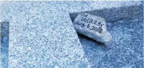  ??  ?? Writer Randy Boswell used a black Sharpie to write a simple message on a small piece of concrete from the Rideau Canal. He then delivered it to Lt.-Col. John By’s grave in the U.K.