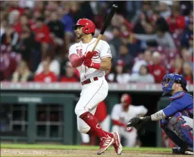  ?? PAUL VERNON — THE ASSOCIATED PRESS ?? Cincinnati Reds’ Tommy Pham, left, watches his home run in front of Chicago Cubs catcher Yan Gomes during the sixth inning of a baseball game in Cincinnati, Monday, May 23, 2022.