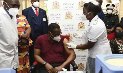  ?? Photograph: Thoko Chikondi/AP ?? Malawi’s president, Lazarus Chakwera, receives an AstraZenec­a vaccine in March. On Tuesday he said intensifyi­ng vaccinatio­n efforts was part of the country’s socioecono­mic recovery plans.