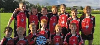  ??  ?? The Kevin’s/Mattock/Glen Emmets squad celebrate their Shield success.