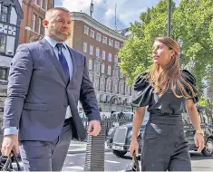  ?? ?? Coleen Rooney and her husband, Wayne, the former England captain, at the High Court