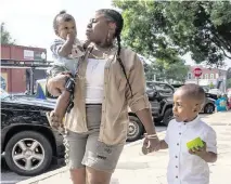  ?? ALYSSA POINTER For The Washington Post ?? MaKayla Walker, out for an ice cream treat with her baby Ean and his brother Eric recently in Covington, Ga., said it felt like the wind had been knocked out of her when she heard about the death of former Olympian Tori Bowie.